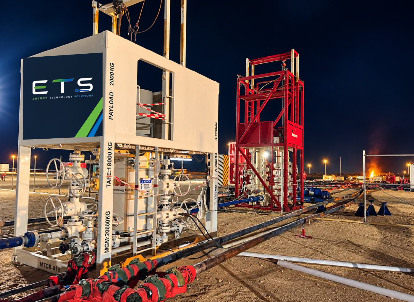 ETS rental package operating on a well site at night
