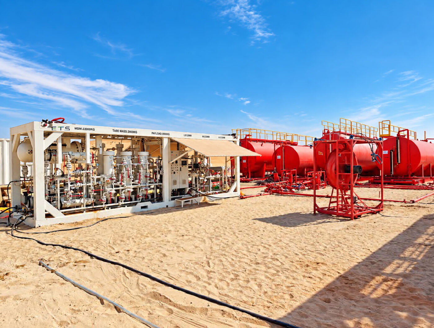 ETS process package and storage tanks on a desert field site